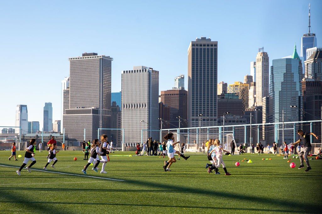 Soccer on the Pier 5 fields with the Manhattan skyline