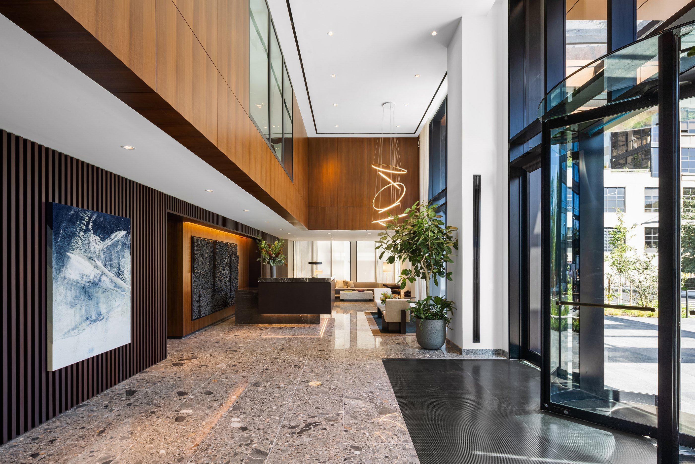 Lobby with wood-slat walls and art