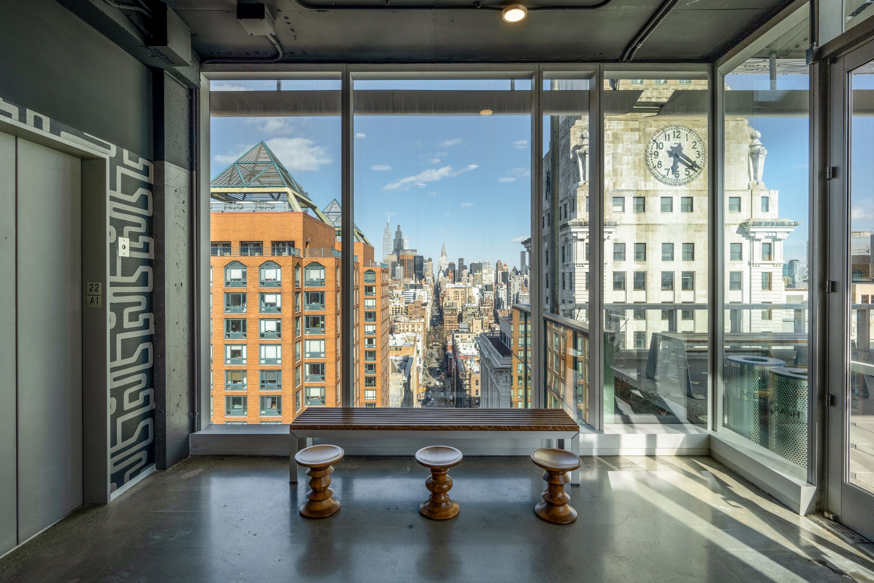 Tenant lounge framing the Con Edison clock tower