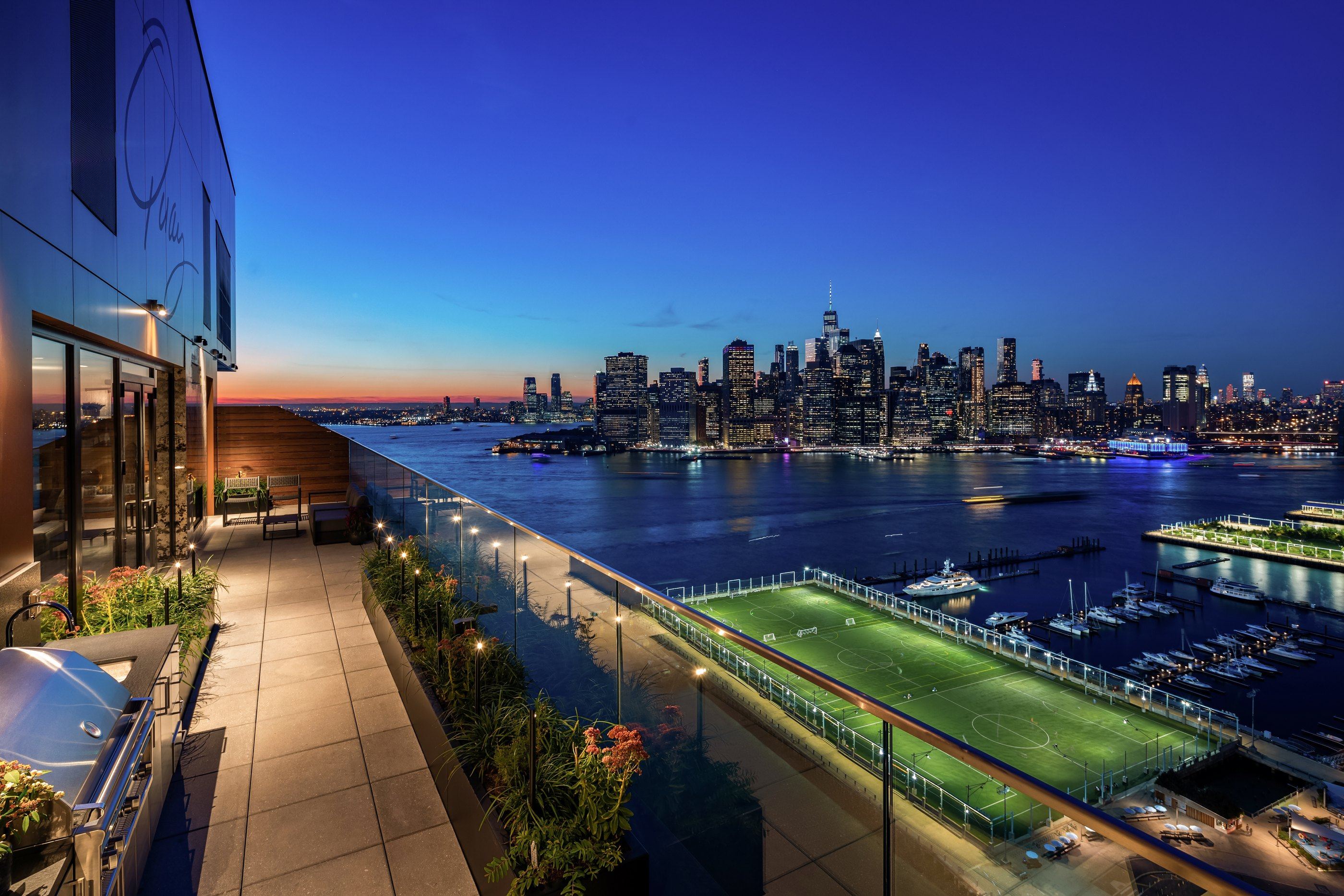 Terrace at dusk overlooking the park and lower Manhattan